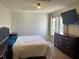 Relaxing bedroom with carpet flooring, natural light, and ample space for furniture at 206 Orchid Dr, Davenport, FL 33897