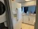 Efficient kitchen layout with modern appliances, offers a seamless cooking experience at 206 Orchid Dr, Davenport, FL 33897