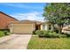 Charming single-story home with a well-maintained lawn, two-car garage and a welcoming entrance at 236 Savannah Preserve Loop, Davenport, FL 33837