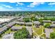 Community aerial view showcasing well-maintained grounds, playground, and convenient access to the surrounding neighborhood at 2423 Branch Way # 207, Maitland, FL 32751