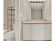 Bathroom features a vanity with cabinets, and a combined bathtub and shower at 2423 Branch Way # 207, Maitland, FL 32751