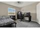 Bedroom with carpet and window, furnished with a bed, desk, and gaming computer setup at 2423 Branch Way # 207, Maitland, FL 32751