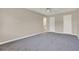 Bedroom with plush carpet, neutral walls, and standard closet doors at 2423 Branch Way # 207, Maitland, FL 32751