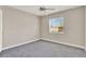 Bedroom featuring carpeted floors, a ceiling fan, and natural light from the window at 2423 Branch Way # 207, Maitland, FL 32751