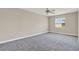Bedroom featuring carpeted floors, neutral walls, and a ceiling fan at 2423 Branch Way # 207, Maitland, FL 32751