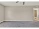 Neutral bedroom with carpet flooring and showing entry to bathroom at 2423 Branch Way # 207, Maitland, FL 32751