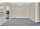Open dining area with new carpeting that flows seamlessly into the kitchen and living room at 2423 Branch Way # 207, Maitland, FL 32751