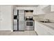 Bright kitchen featuring stainless steel appliances and white cabinetry for a clean, modern look at 2423 Branch Way # 207, Maitland, FL 32751