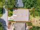 Aerial view highlighting the property boundaries, roof, landscaping, and surrounding neighborhood at 25243 River Crest Dr, Leesburg, FL 34748