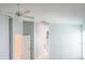 Bedroom features light blue walls, white trim, white door, and neutral carpet at 25243 River Crest Dr, Leesburg, FL 34748