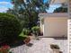 Charming home with landscaped front yard, brick pathway, and inviting curb appeal at 25243 River Crest Dr, Leesburg, FL 34748