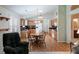 Charming eat-in kitchen featuring wood cabinets, granite countertops and hardwood floors at 25243 River Crest Dr, Leesburg, FL 34748