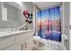 Charming bathroom with a granite-topped vanity, bright lighting, and unique decor for a stylish touch at 2530 Maneshaw Ln, Kissimmee, FL 34747