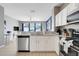 Beautifully updated kitchen with modern appliances and a breakfast bar overlooking the living area at 2530 Maneshaw Ln, Kissimmee, FL 34747