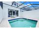 Enjoy outdoor dining by your private pool, easily accessible through sliding glass doors from the house at 2530 Maneshaw Ln, Kissimmee, FL 34747