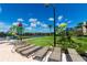 The sun-drenched water park, surrounded by lounge chairs, offers endless fun for all ages on a cloudless day at 2530 Maneshaw Ln, Kissimmee, FL 34747