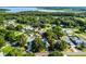 Aerial view of a property near lake and surrounded by lush green landscape at 2711 Bayview Dr, Eustis, FL 32726