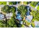 Aerial view of property surrounded by mature trees in established neighborhood at 2711 Bayview Dr, Eustis, FL 32726
