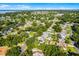Beautiful aerial view of a lakeside community with mature trees and well-maintained homes at 2711 Bayview Dr, Eustis, FL 32726