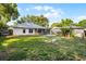 Large backyard featuring partial fence, shed, and mature trees at 2711 Bayview Dr, Eustis, FL 32726