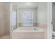 Modern bathroom with soaking tub and bright natural light at 2711 Bayview Dr, Eustis, FL 32726
