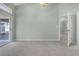 Bright bedroom with sliding glass doors and an entrance to a hallway at 2711 Bayview Dr, Eustis, FL 32726