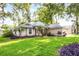 Inviting single-Gathering home with mature, colorful landscaping and a well-maintained lawn creating beautiful curb appeal at 2711 Bayview Dr, Eustis, FL 32726