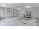 Spacious two-car garage with ample storage and bright overhead lighting at 2711 Bayview Dr, Eustis, FL 32726