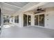 Covered patio with neutral concrete and view of the backyard at 2711 Bayview Dr, Eustis, FL 32726