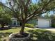 Charming single-story home featuring a two-car garage, lush landscaping, and mature tree offering curb appeal at 2850 Aragon Ter, Lake Mary, FL 32746