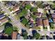 An aerial view of a home with a well-maintained lawn nestled on a tree-lined street in a quiet neighborhood at 2850 Aragon Ter, Lake Mary, FL 32746