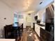 Bright kitchen with modern appliances, light blue walls, and dark wood dining table set at 2850 Aragon Ter, Lake Mary, FL 32746
