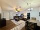 Spacious living room featuring modern decor, a ceiling fan, and hardwood flooring at 2850 Aragon Ter, Lake Mary, FL 32746