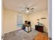 Home office with neutral carpet, ceiling fan, and a window for natural light at 2850 Aragon Ter, Lake Mary, FL 32746
