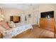 Comfortable bedroom with wood floors, closet, and a ceiling fan at 3008 Bridgefield Ct, The Villages, FL 32162