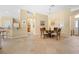 Inviting dining area with tiled floors, round table and seamless flow to adjacent living spaces at 3008 Bridgefield Ct, The Villages, FL 32162