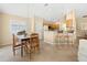 Eat-in kitchen dining area, with tile floors, lots of light and breakfast bar seating at 3008 Bridgefield Ct, The Villages, FL 32162