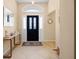 A welcoming foyer with neutral tones, decorated with console table and stylish decor at 3008 Bridgefield Ct, The Villages, FL 32162