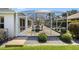 Enclosed patio with dining table set, pea gravel, manicured bushes, and ample space for entertaining at 3008 Bridgefield Ct, The Villages, FL 32162
