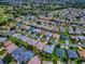 High angle showing a well-planned residential community with manicured lawns and mature trees at 3112 Burbank Ln, The Villages, FL 32162