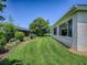 Manicured backyard featuring lush landscaping and well-kept lawn at 3112 Burbank Ln, The Villages, FL 32162