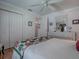 Bright bedroom with a large dresser, white trim and a patterned quilt at 3112 Burbank Ln, The Villages, FL 32162