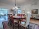 Dining room with hardwood floors, a chandelier, and views of living room at 3112 Burbank Ln, The Villages, FL 32162