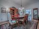 Formal dining room with hardwood floors, buffet, and elegant lighting at 3112 Burbank Ln, The Villages, FL 32162