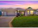 Charming single-story home featuring a two-car garage, well-kept lawn, and inviting curb appeal at 3112 Burbank Ln, The Villages, FL 32162