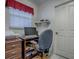 Functional home office featuring a desk, drawers, computer and comfortable chair at 3112 Burbank Ln, The Villages, FL 32162