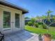 Enjoy outdoor living on this tiled patio with mature landscaping at 3112 Burbank Ln, The Villages, FL 32162