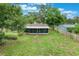 Aerial view of property shows lush landscaping and large yard at 315 W 11Th Ave, Mount Dora, FL 32757