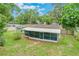 Aerial view of home showcasing screened in lanai and large backyard at 315 W 11Th Ave, Mount Dora, FL 32757