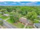 Established neighborhood featuring a cozy single-story home with a well-kept lawn, mature trees, and inviting curb appeal at 315 W 11Th Ave, Mount Dora, FL 32757